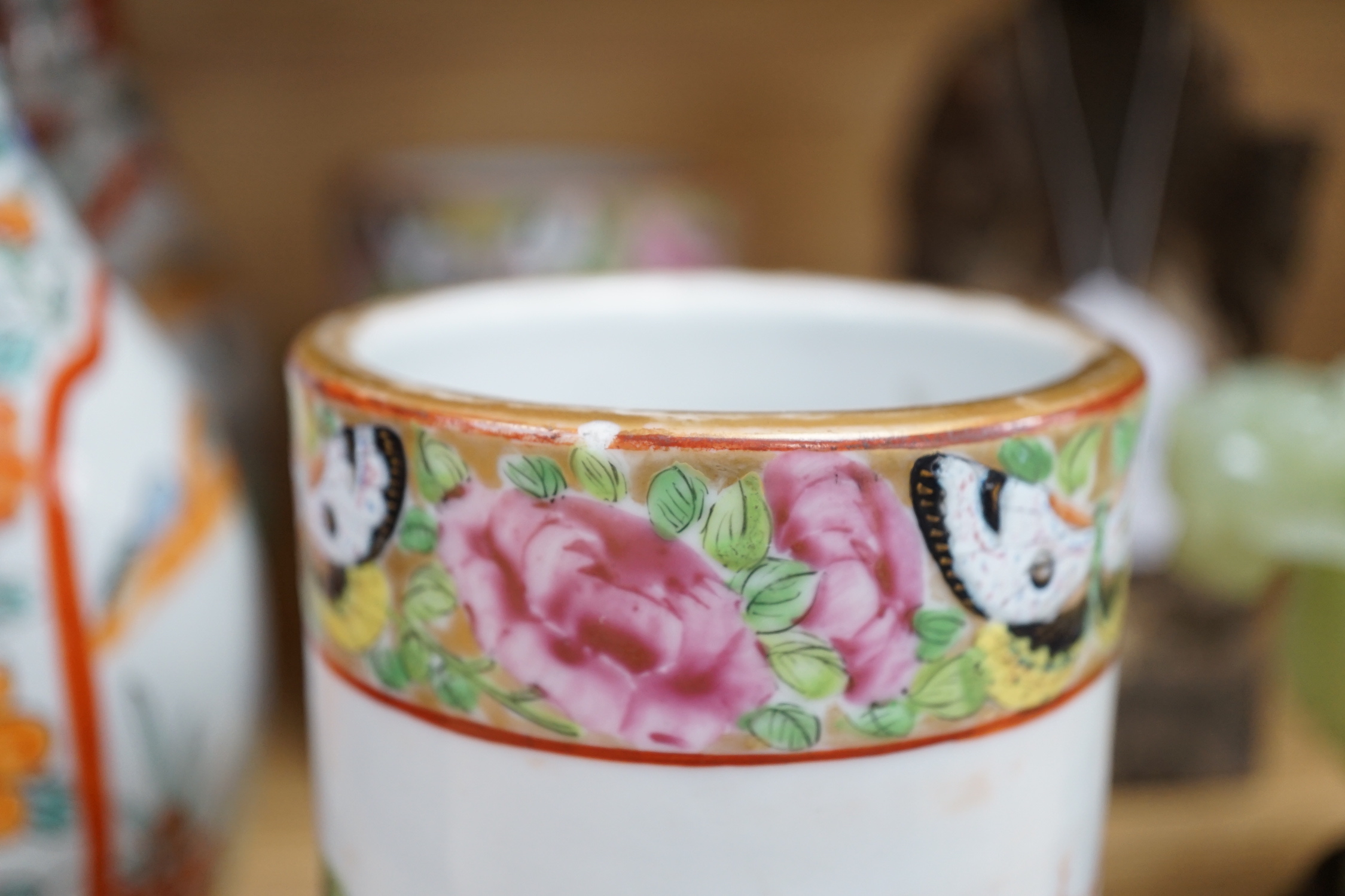 A pair of 19th century Cantonese famille rose porcelain brushpots, decorated with figural scenes, together with a further pair of Japanese export vases (4)